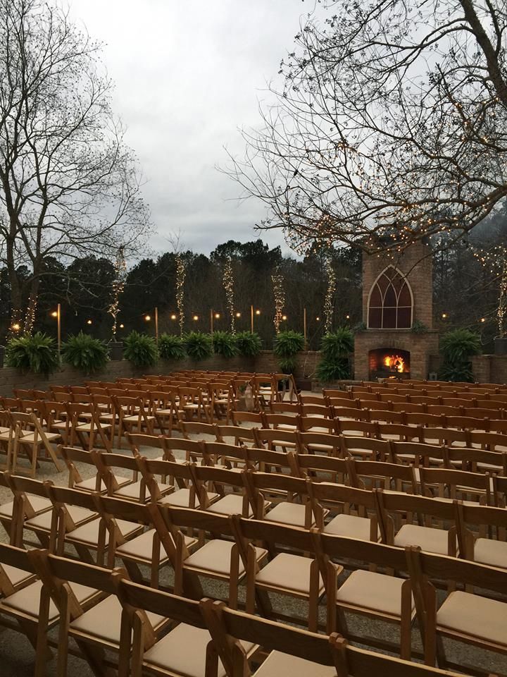 string lights in trees outside wedding venue