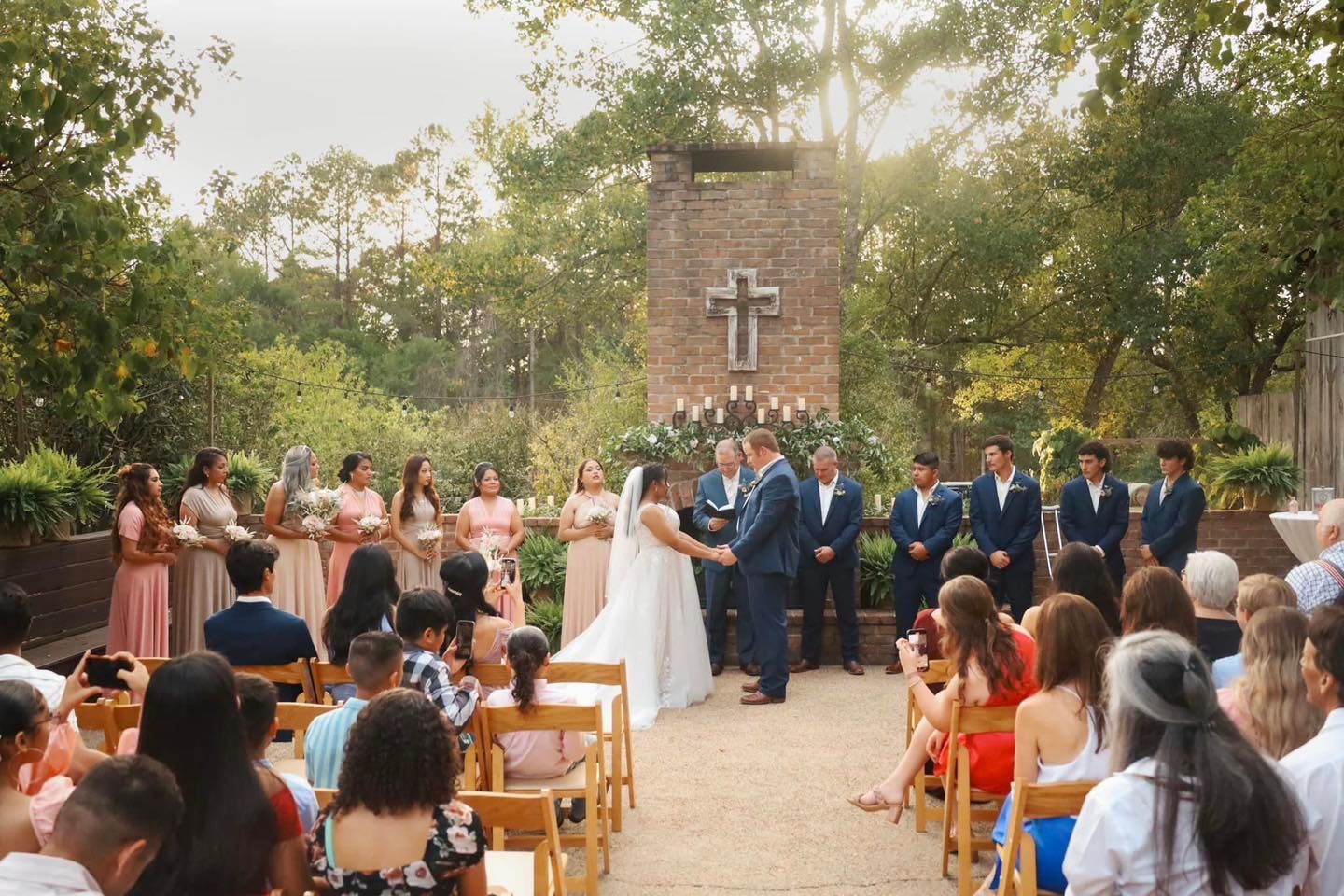 bride and groom saying vows during outdoor wedding