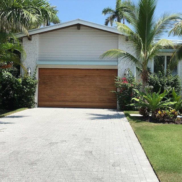 Outside View Of A Garage With Wooden Door — Naples FL — Garage Doors of Naples