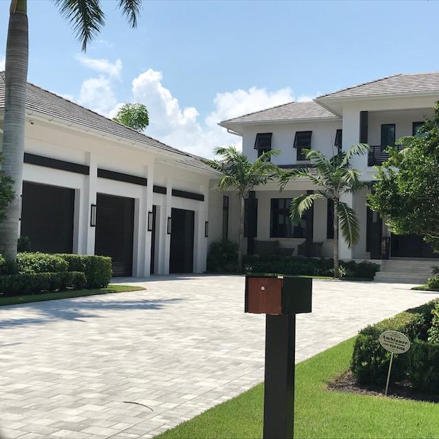 Outside View Of A Garage With Wooden Door — Naples FL — Garage Doors of Naples