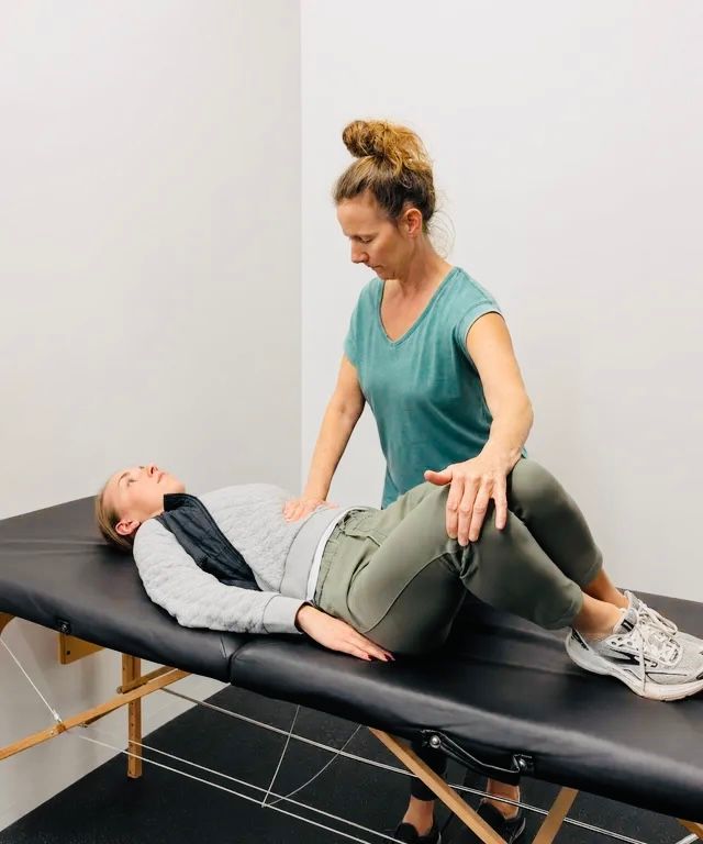 Joi guiding a client through a personalized movement therapy assessment.
