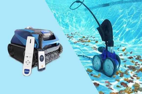 A robotic vacuum cleaner is sitting next to a swimming pool.