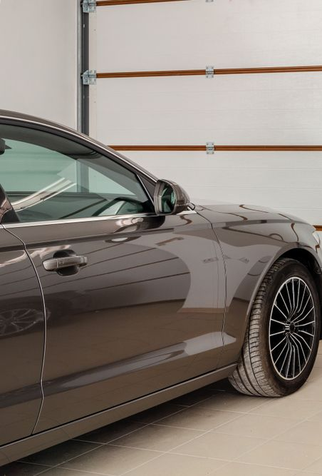 Dark Gray Car Parked Inside a Garage — O'Brien Carglass & Tinting in Malanda, QLD