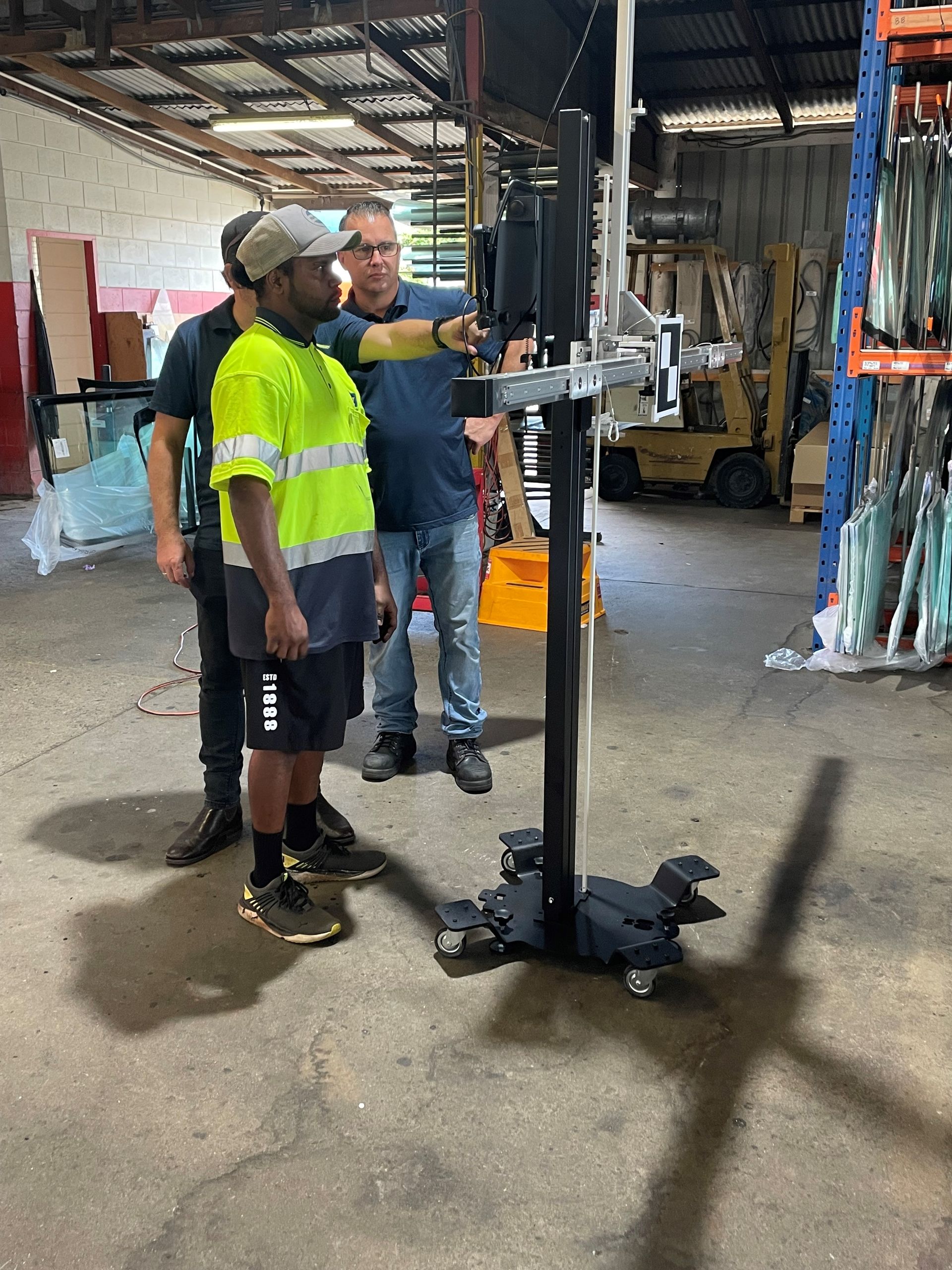 Technicians Evaluating Car Glass Tint Prior to Installation — O'Brien Carglass & Tinting in Mareeba, QLD