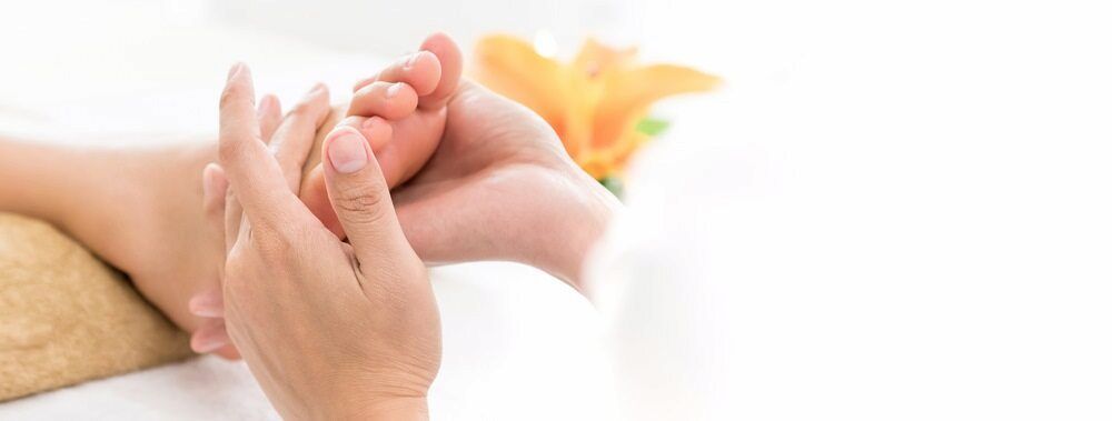 A Woman Is Getting A Foot — Lake Macquarie Podiatry in Belmont, NSW