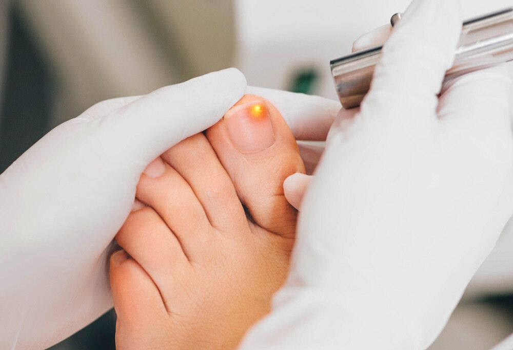 A Person's Foot Being Examined By A Doctor — Lake Macquarie Podiatry in Rathmines, NSW