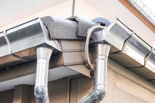 Gutter Installation — Rain Gutter System on Roof of House in Edinburg, TX
