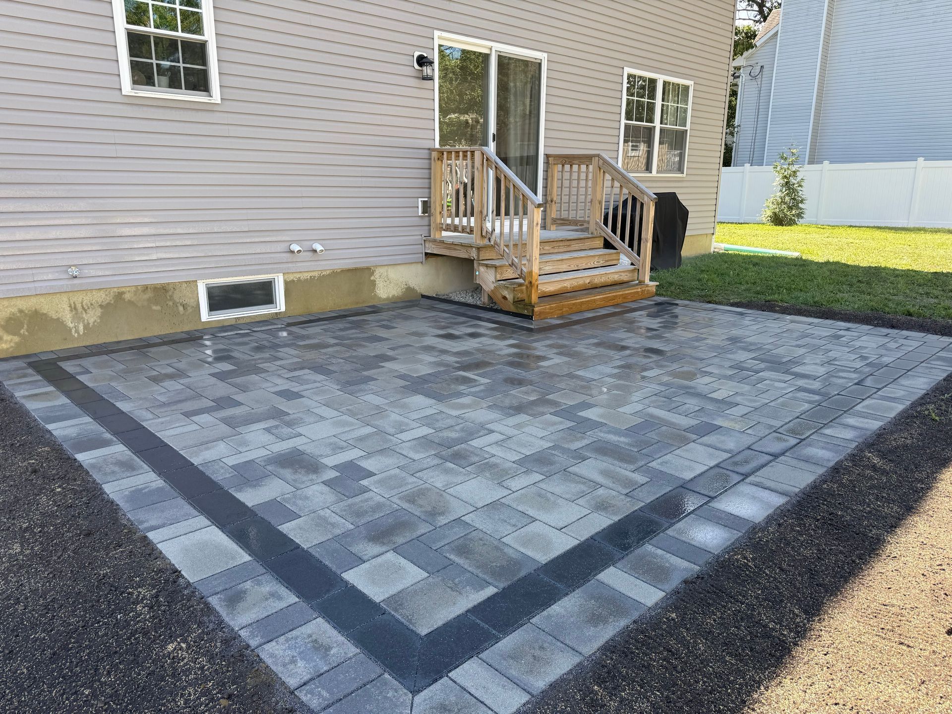 Backyard paver patio with clean layout and finished surface