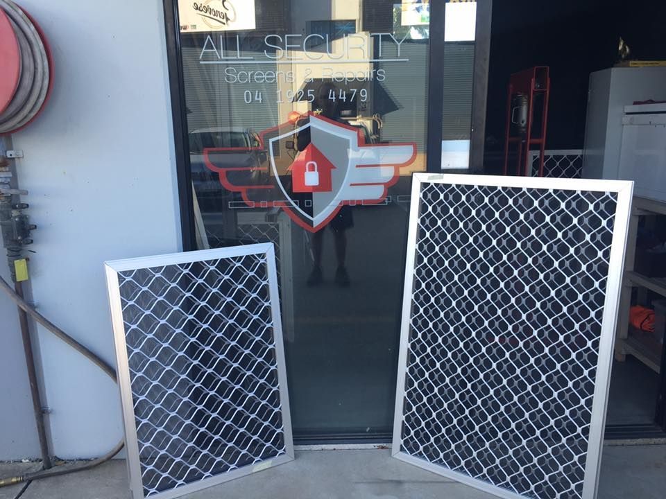 Two Silver Security Window Screens With Diamond-patterned Mesh — All Security Screens & Repairs In Bungalow, QLD