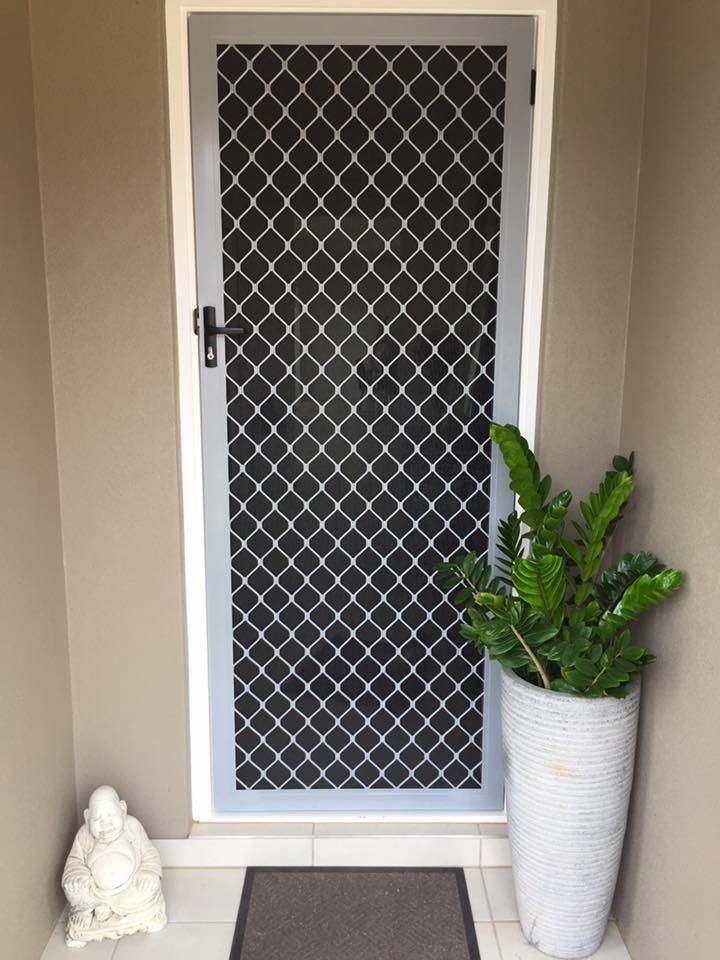 Screen Door With Diamond Pattern, Potted Fern and Small Statue — All Security Screens & Repairs In Bungalow, QLD