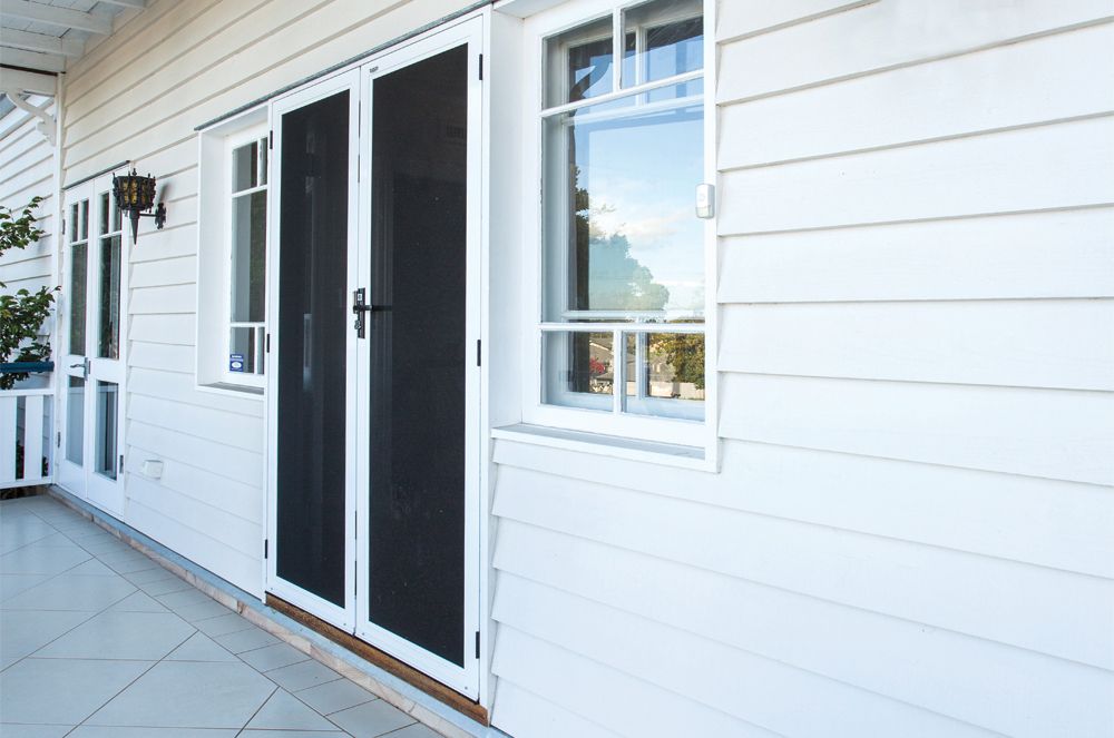 Silver Door Closer Mounted on a Brown Door Frame. White Ceiling and Wall — All Security Screens & Repairs In Bungalow, QLD