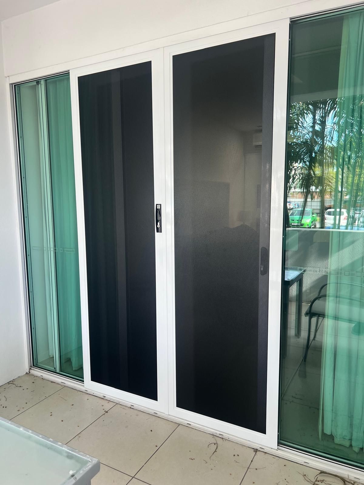 Sliding Glass Doors With White Frames and Black Screen Doors — All Security Screens & Repairs In Bungalow, QLD