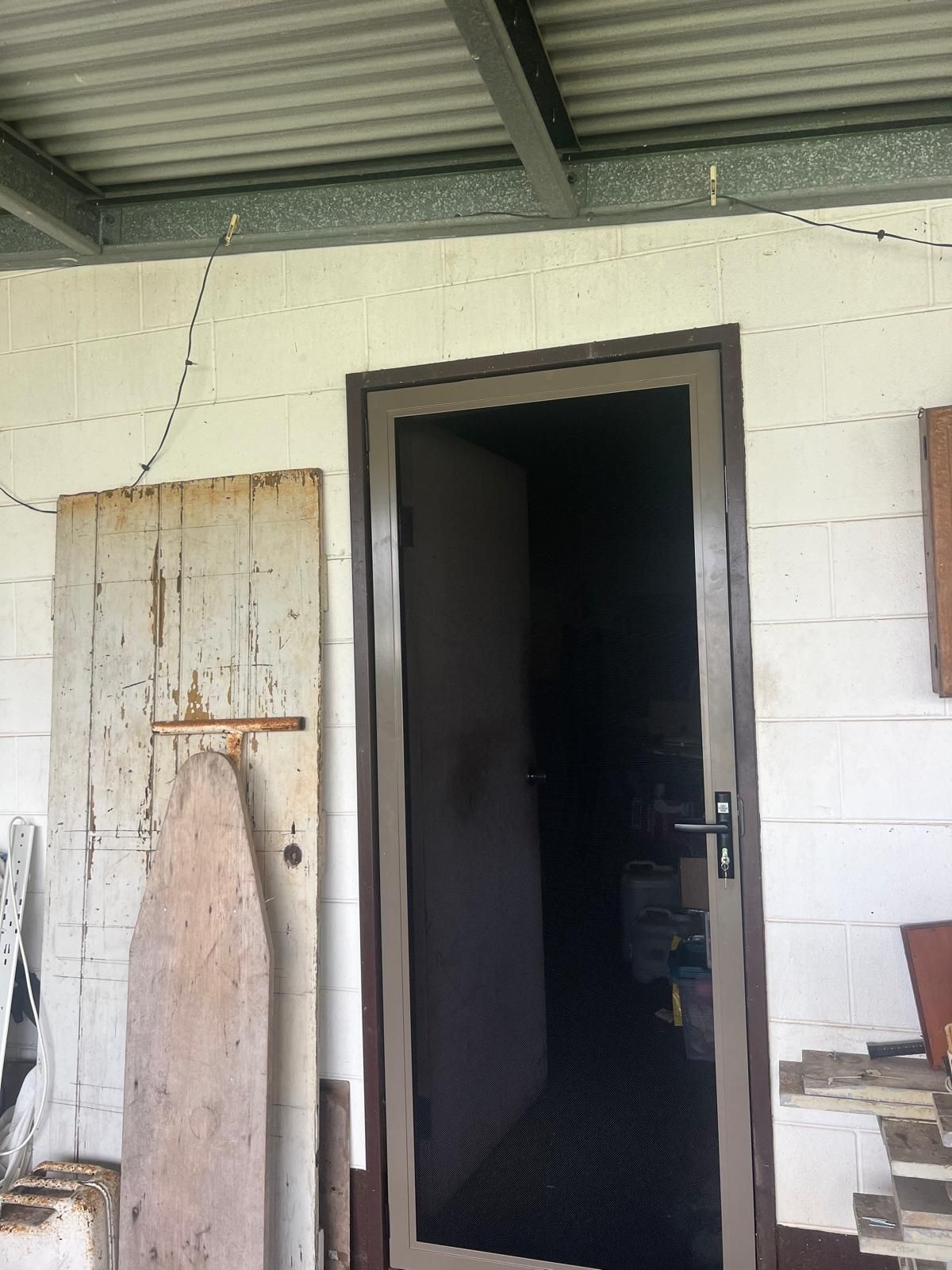 Exterior Door With a Screen, Brown Frame, White Wall — All Security Screens & Repairs In Bungalow, QLD