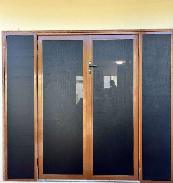 Silver Door With a Security Screen Door Open Against a Brick Wall — All Security Screens & Repairs In Bungalow, QLD