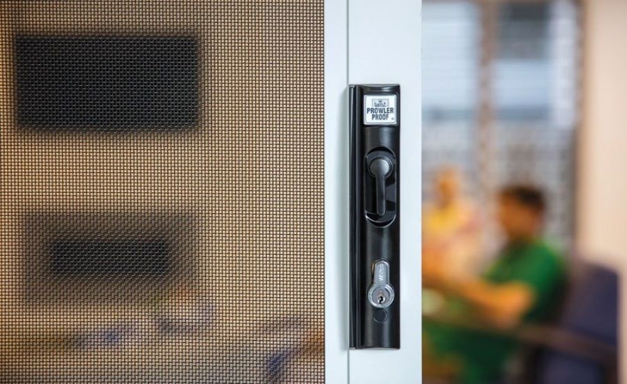 Aluminum Screen Door With Black Handle, on Brick Wall — All Security Screens & Repairs In Bungalow, QLD