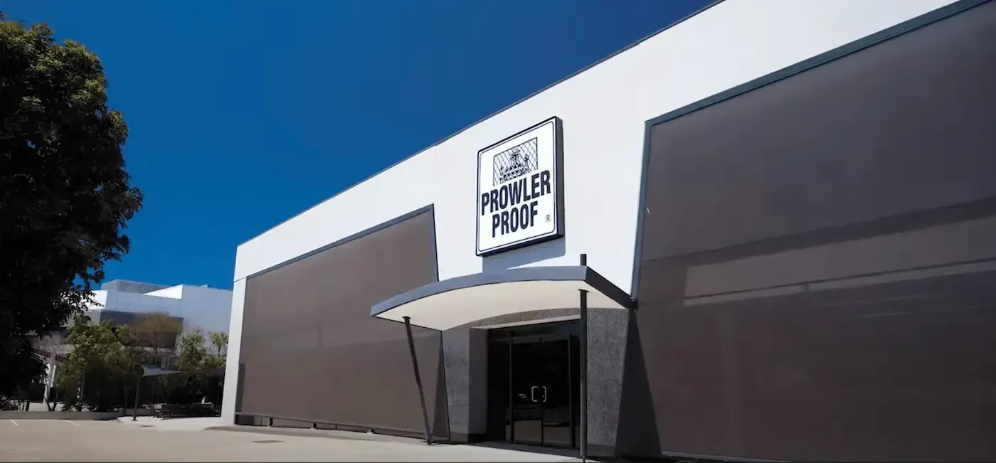 Exterior View of a Building With Prowler Proof Sign Above the Entrance — All Security Screens & Repairs In Bungalow, QLD