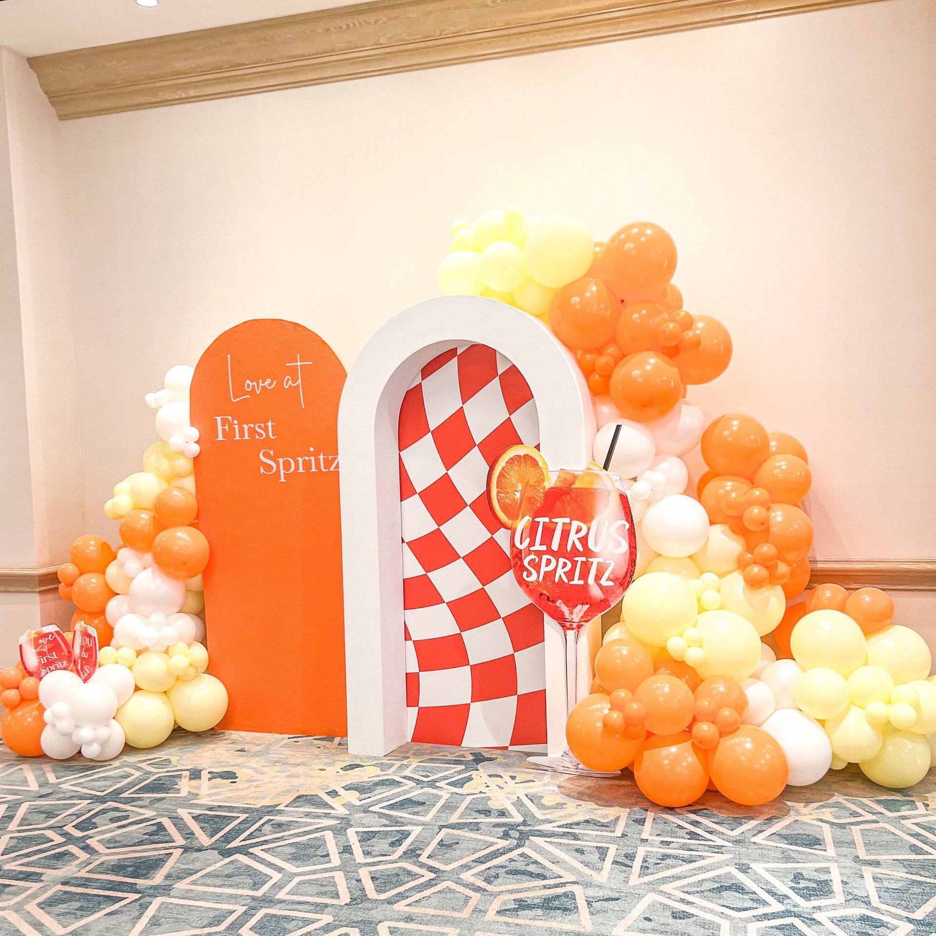 A room filled with balloons and a sign that says lemon sprite