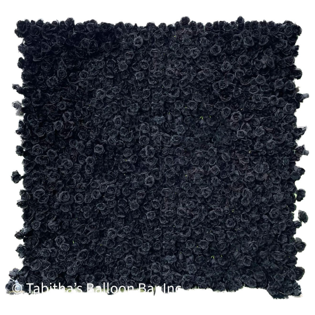a black carpet with a lot of small balls on it