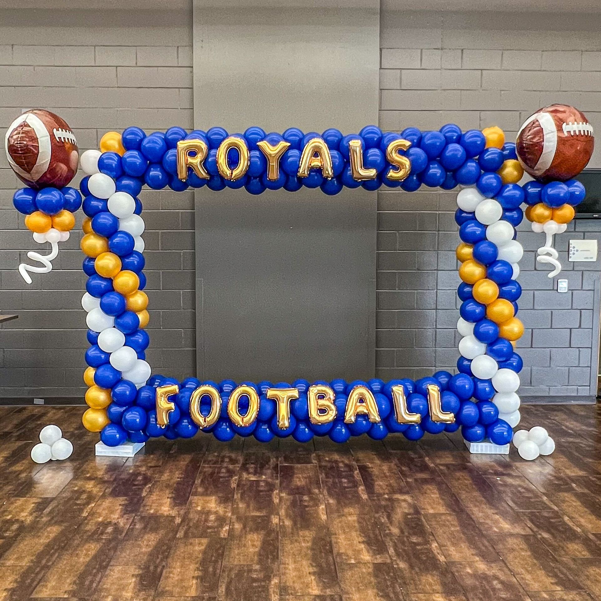 a picture frame made of balloons that says royals football