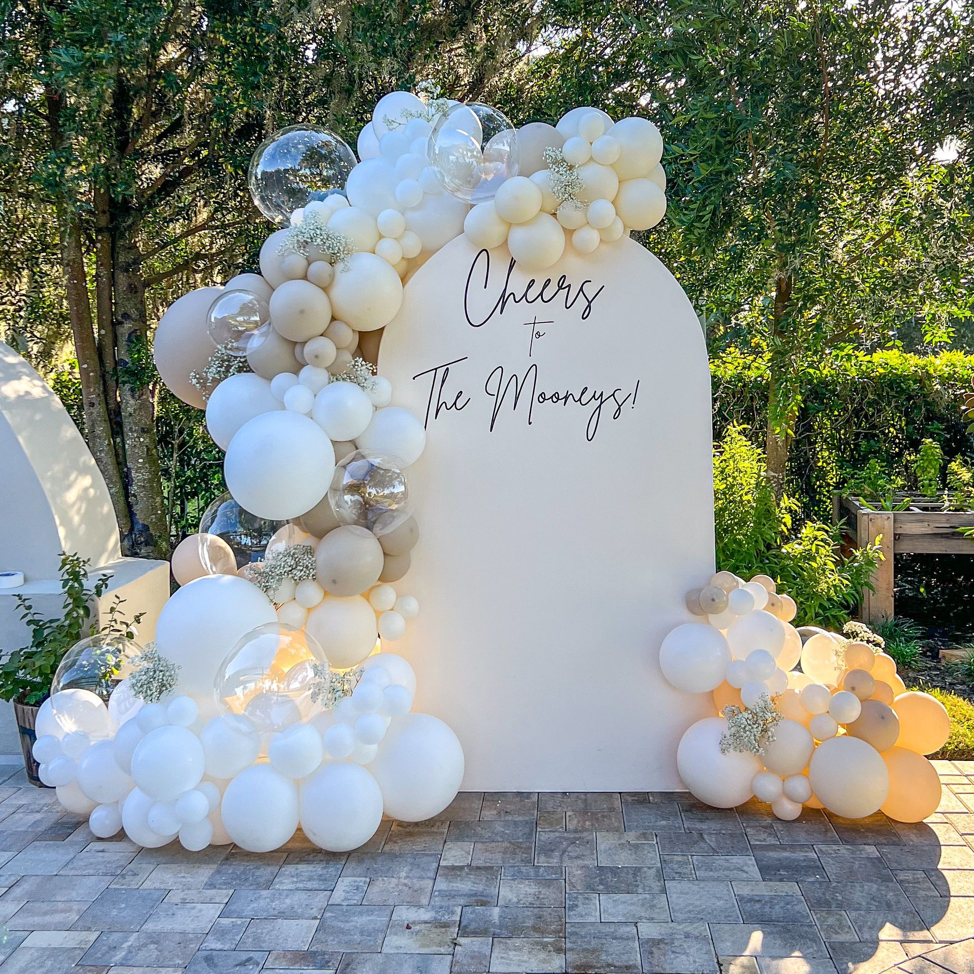 a wall covered in balloons with a sign that says `` guess the gender '' .