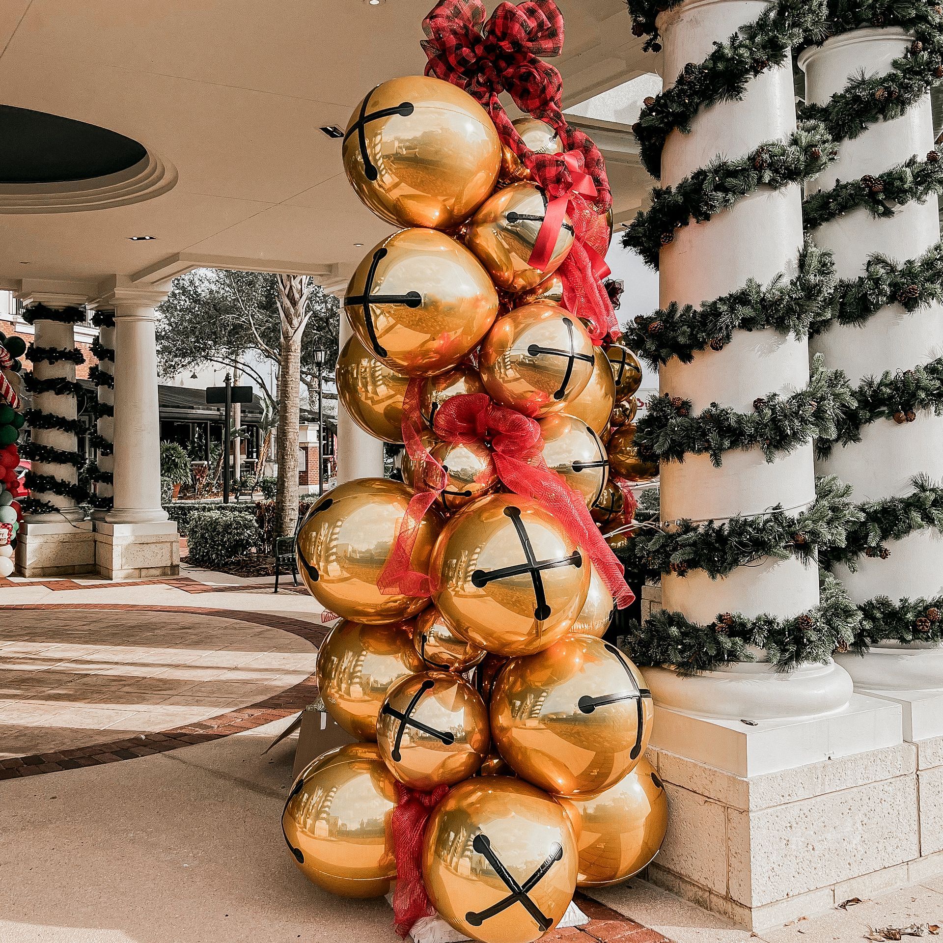 A stack of gold balloons with x 's on them