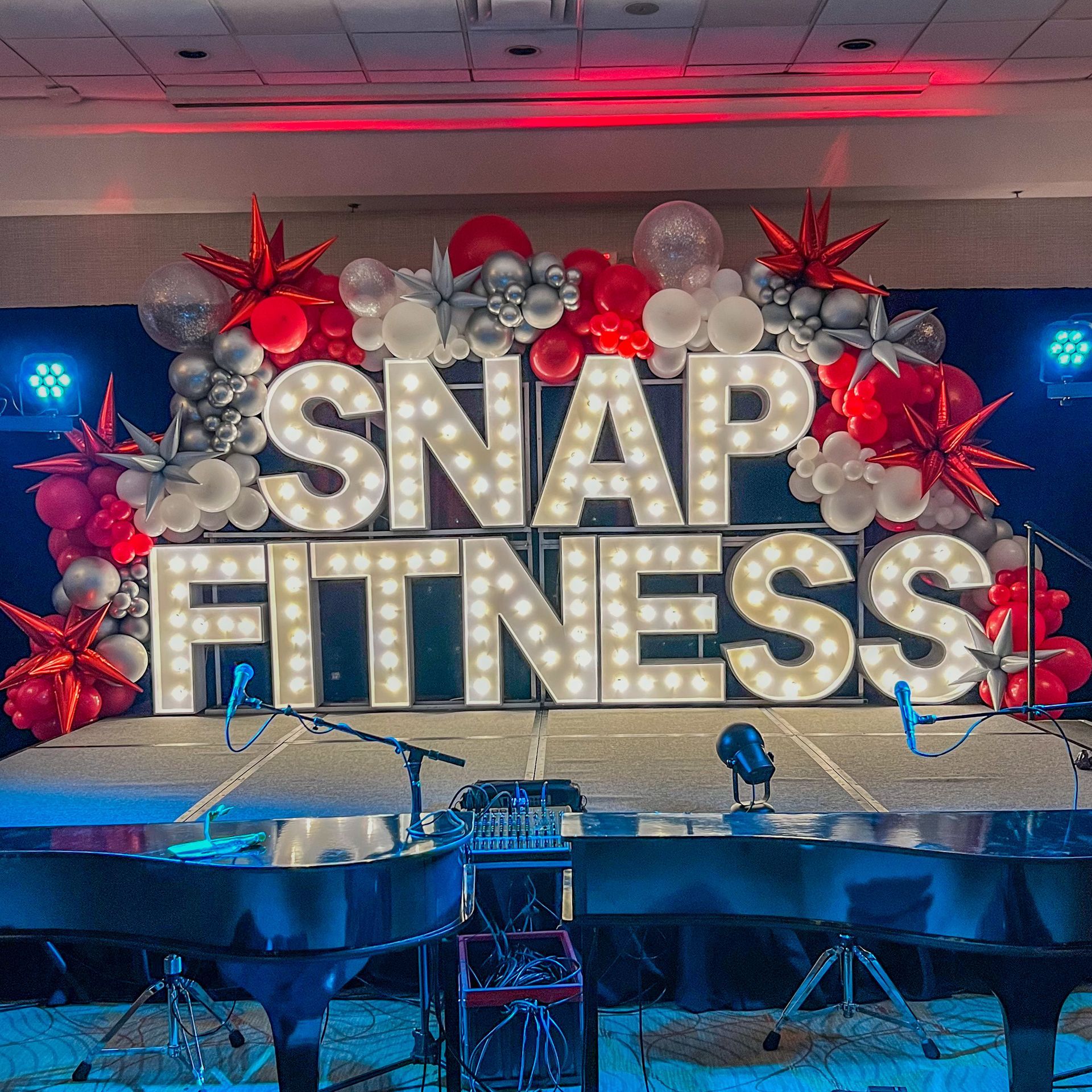 A stage with a sign that says snap fitness