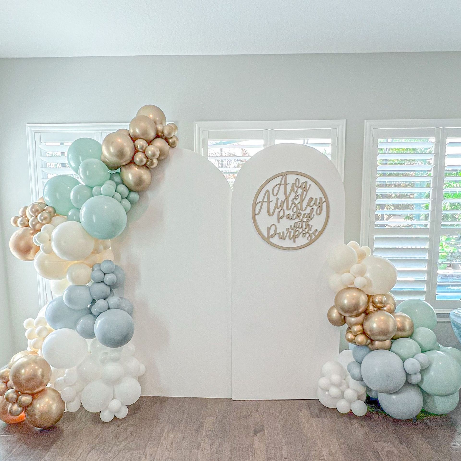 a room filled with balloons and a white wall .