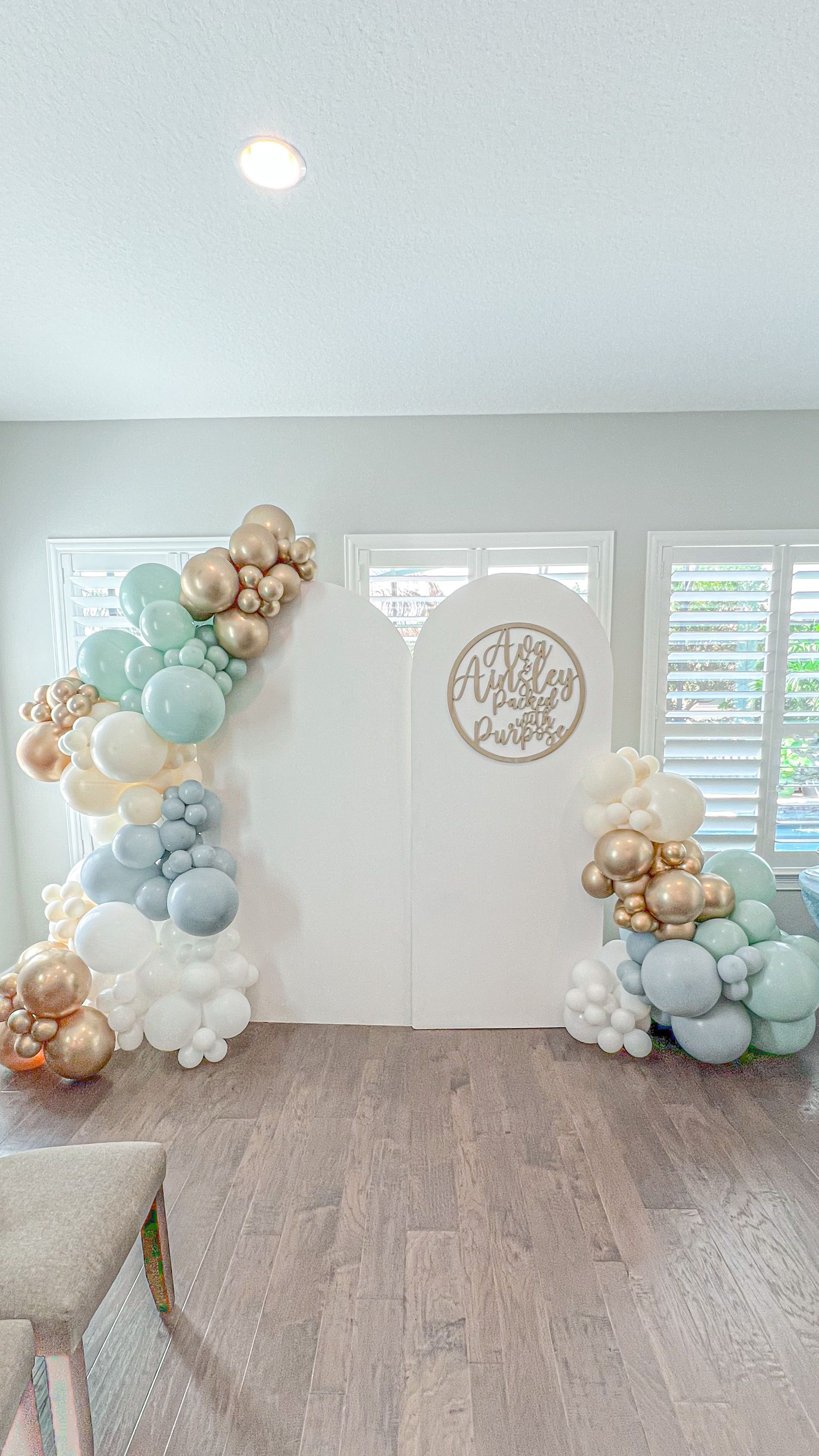 A room filled with balloons and a chair.