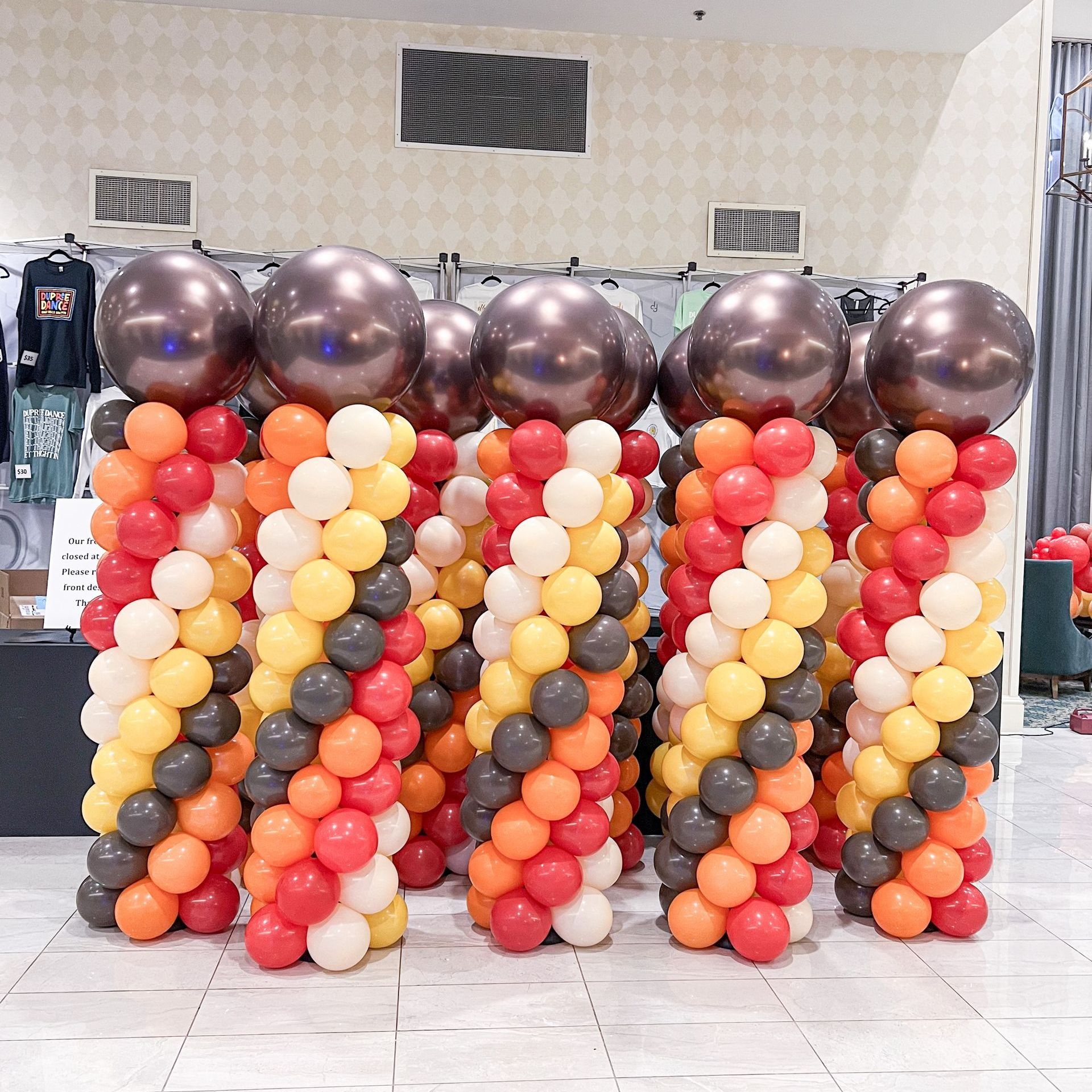 A bunch of balloons are stacked on top of each other