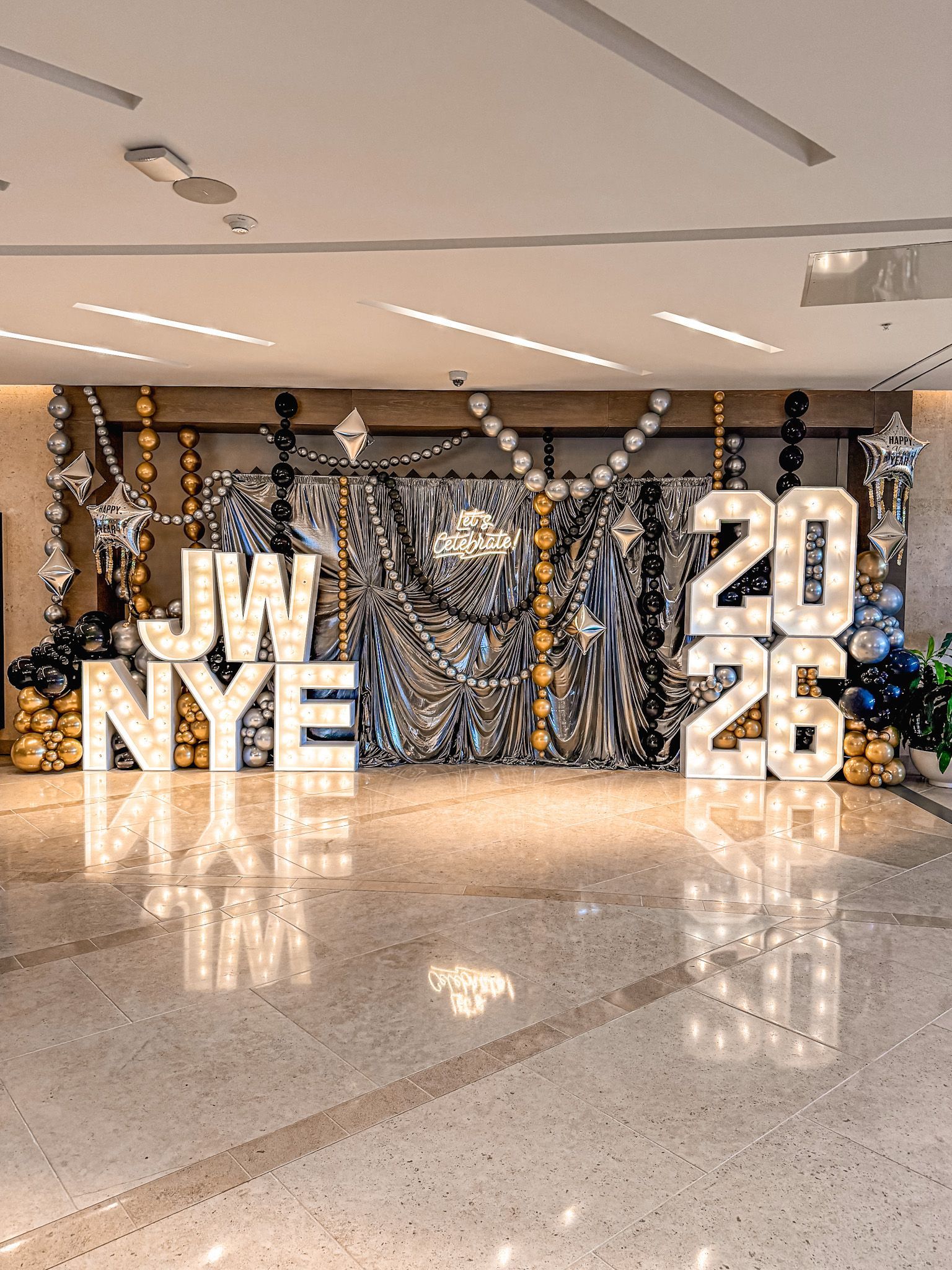 New Year's Eve event backdrop with illuminated 