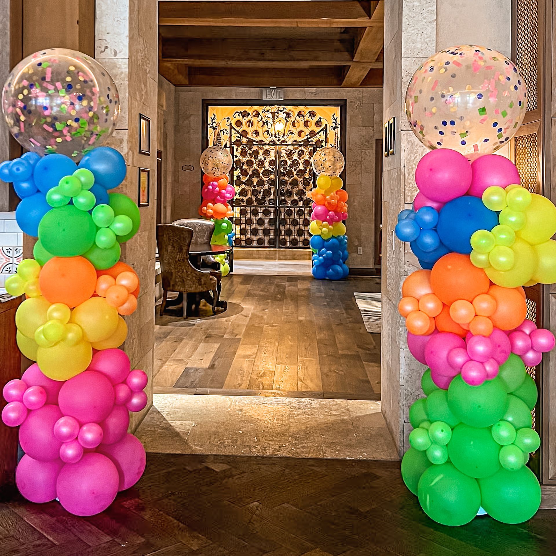 A hallway filled with lots of colorful balloons.
