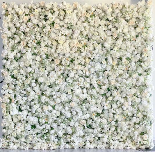 a square of white flowers and green leaves on a white background .