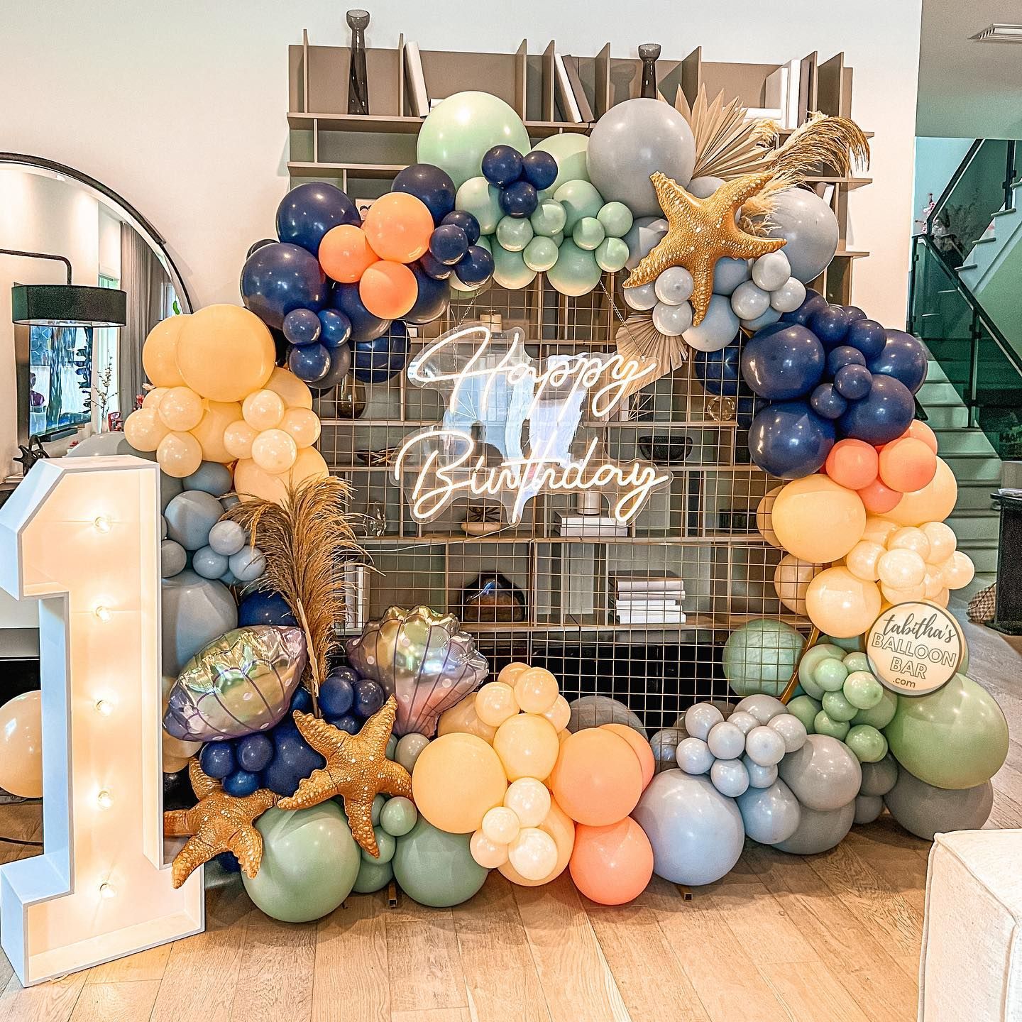 A bunch of balloons are sitting on the floor in a room.