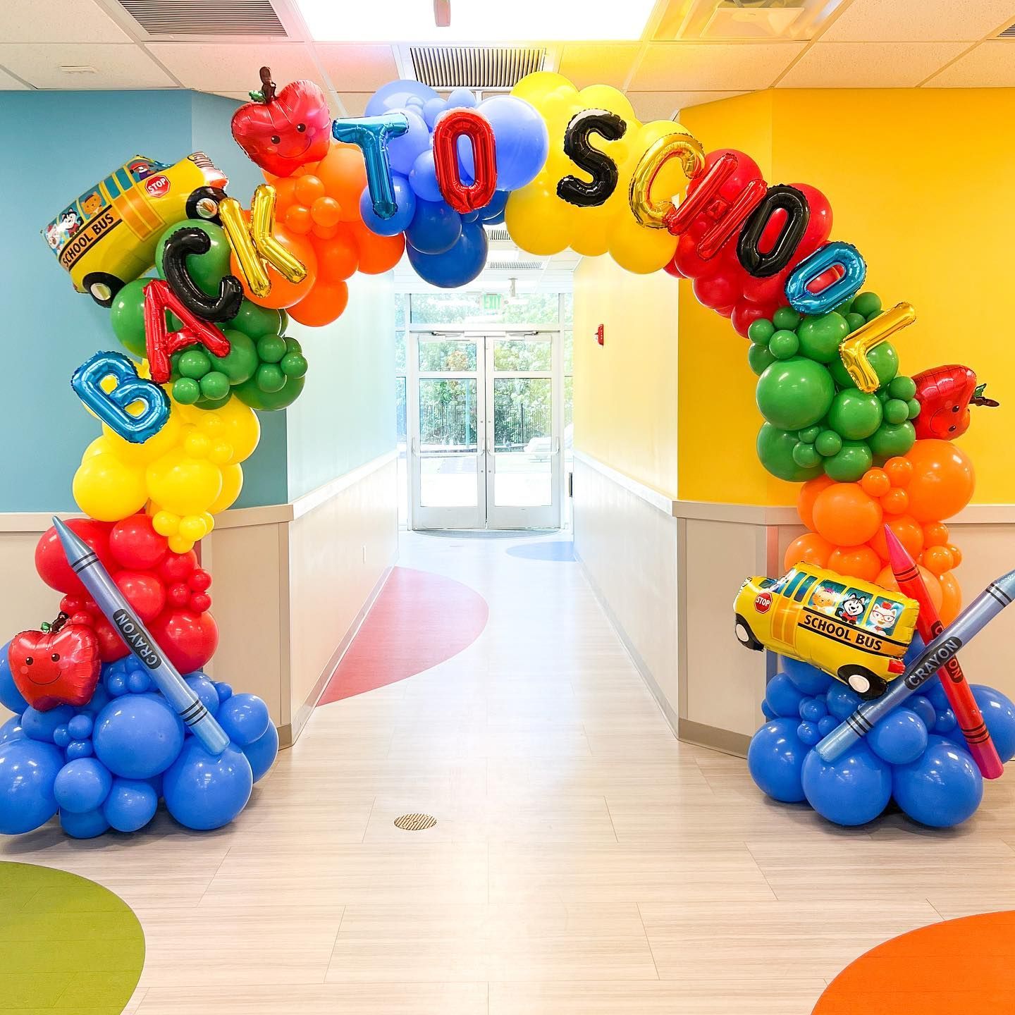 A colorful balloon arch with the words back to school written on it