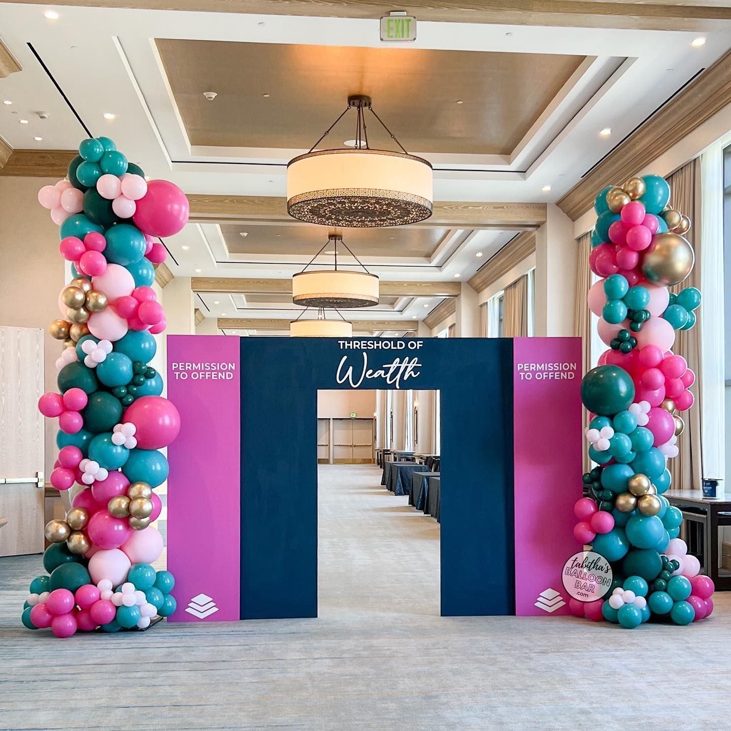 A room filled with balloons and a sign that says what i want