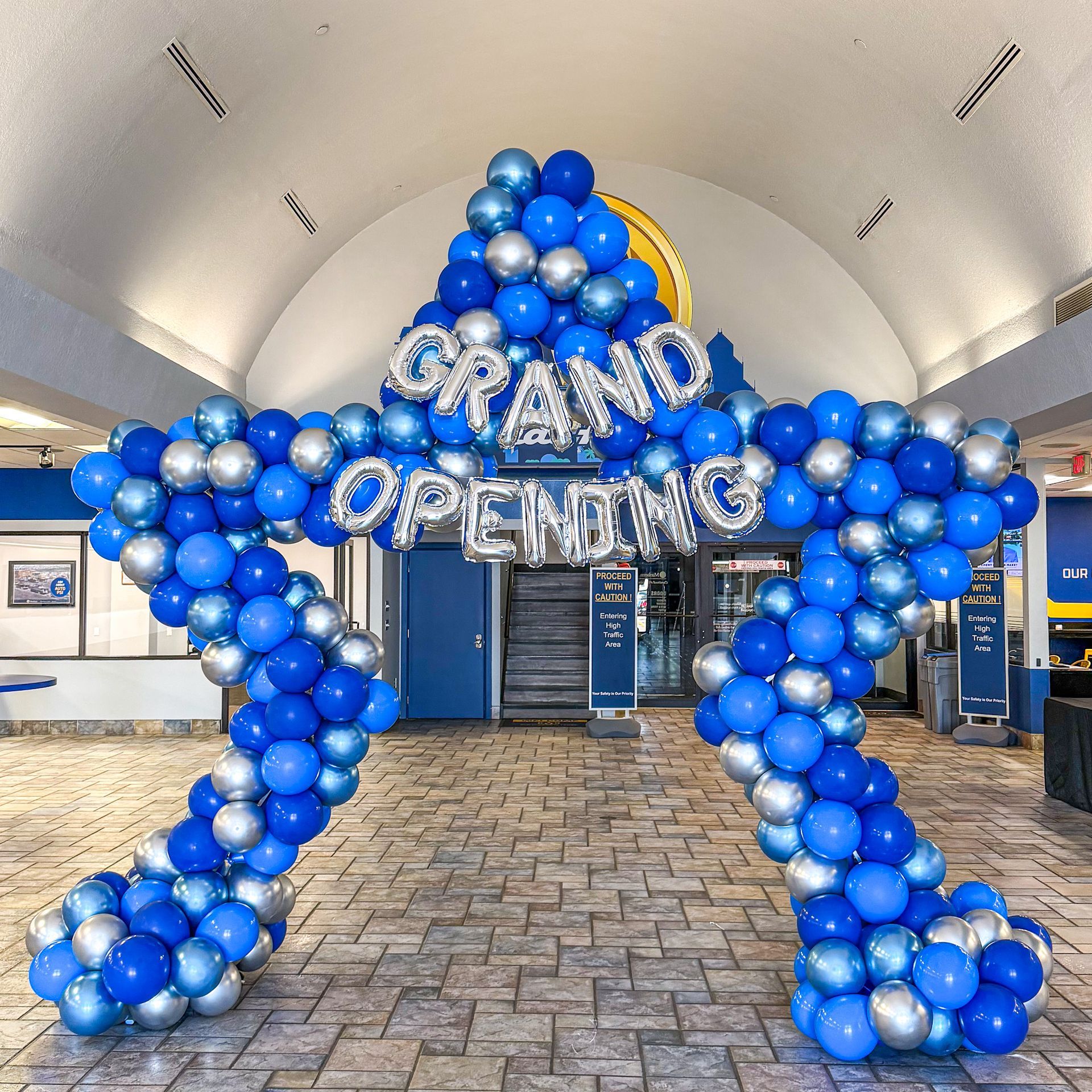 Grand opening balloon arch and storefront decoration for a business launch