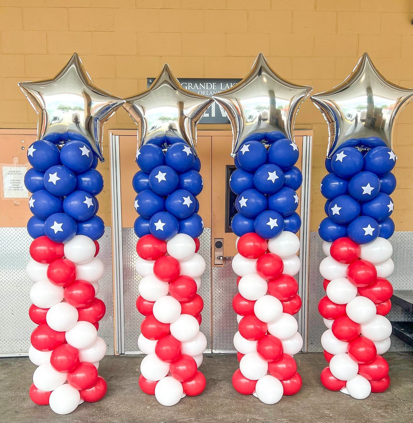 three columns of red, white, and blue with stars on top celebrating 4th of july