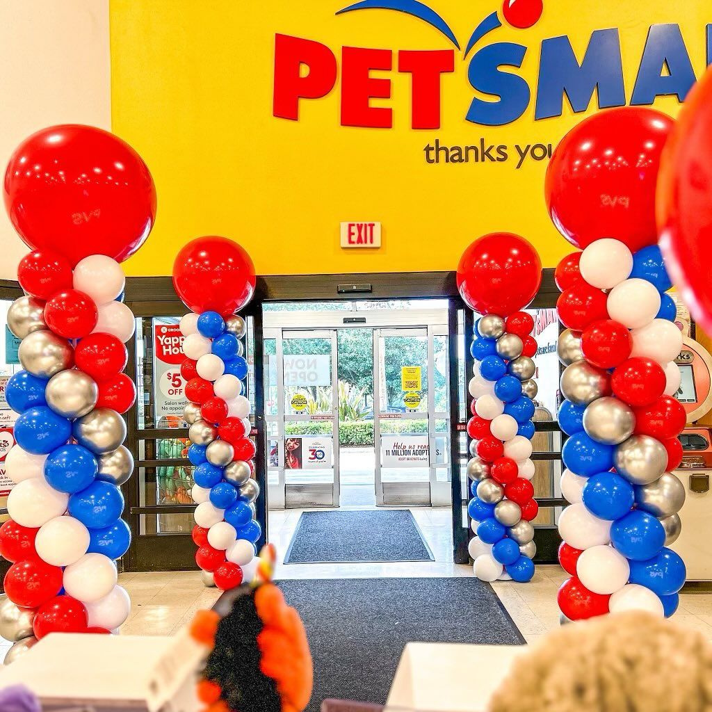 Red white and blue balloons in front of a petsmart store
