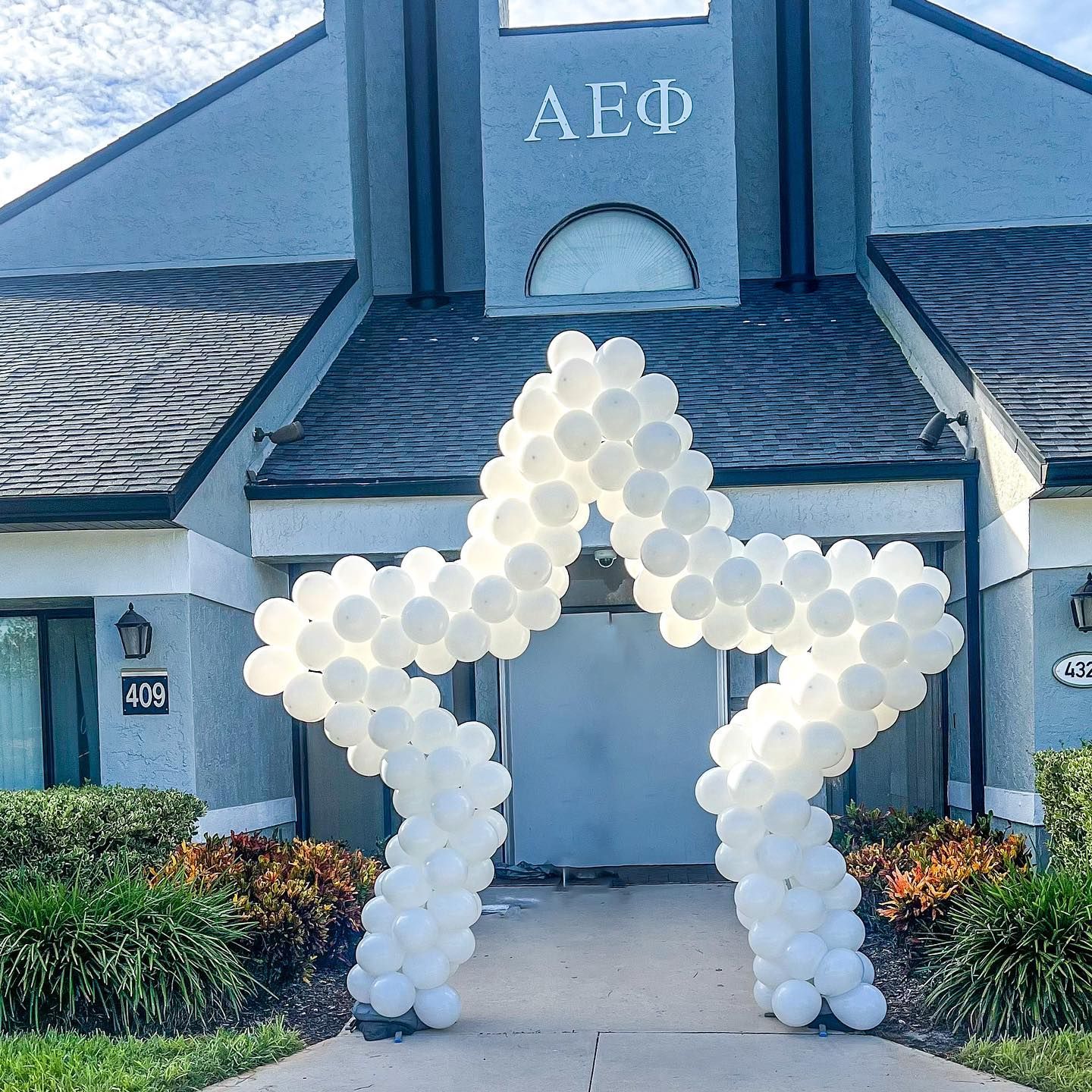 A building with a star made of balloons in front of it