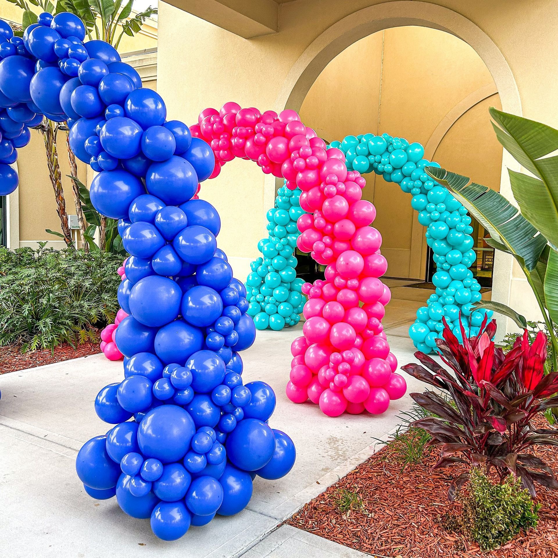 A large building with balloons in front of it.