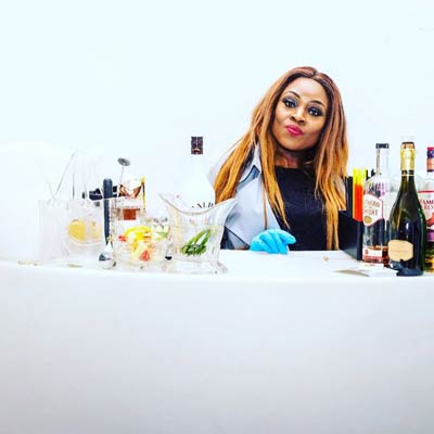 woman posing with a bottle of malibu