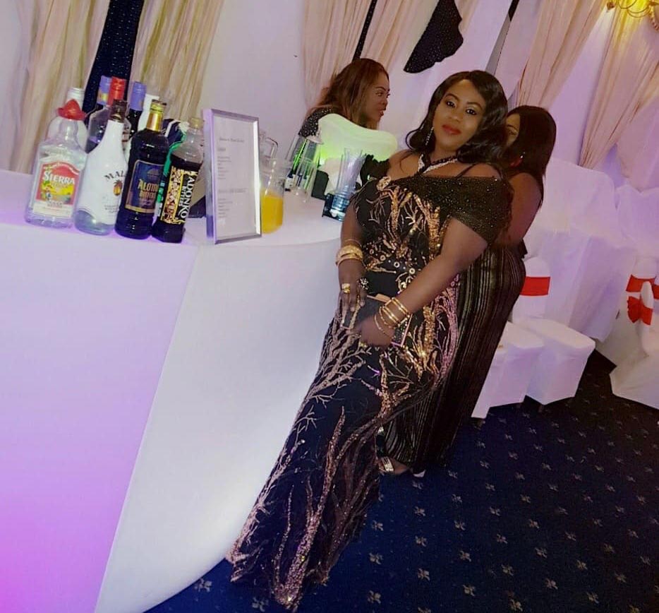 party guests stood at bar