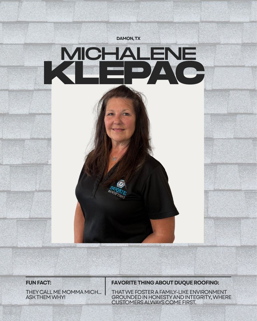 Michalene Klepac, in front of a neutral backdrop, promoting a roofing company, smiling, wearing a black shirt.