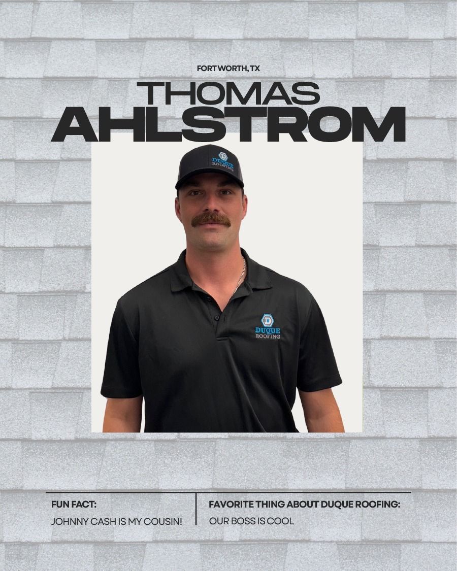 Thomas Ahlstrom in front of a white roof background, wearing a black shirt and cap.