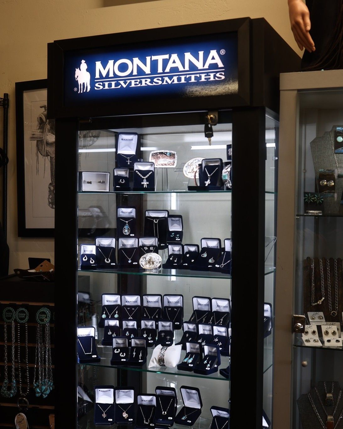A montana silversmiths display case filled with jewelry