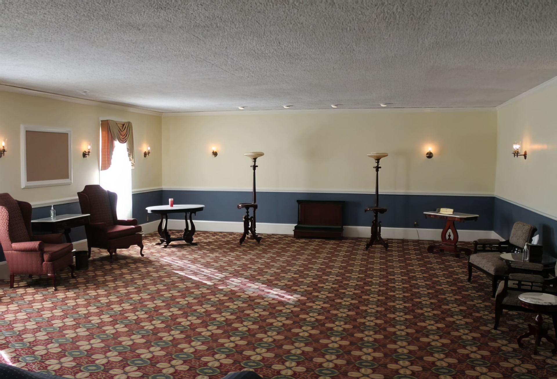 An empty room with chairs and tables in it