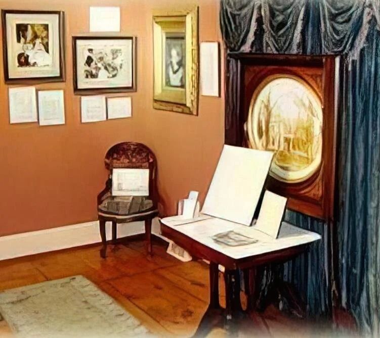A room with pictures on the wall and a table