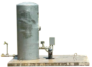 A metal tank with a faucet attached to it is sitting on top of a wooden platform.