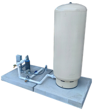 A water tank is sitting on top of a concrete platform.