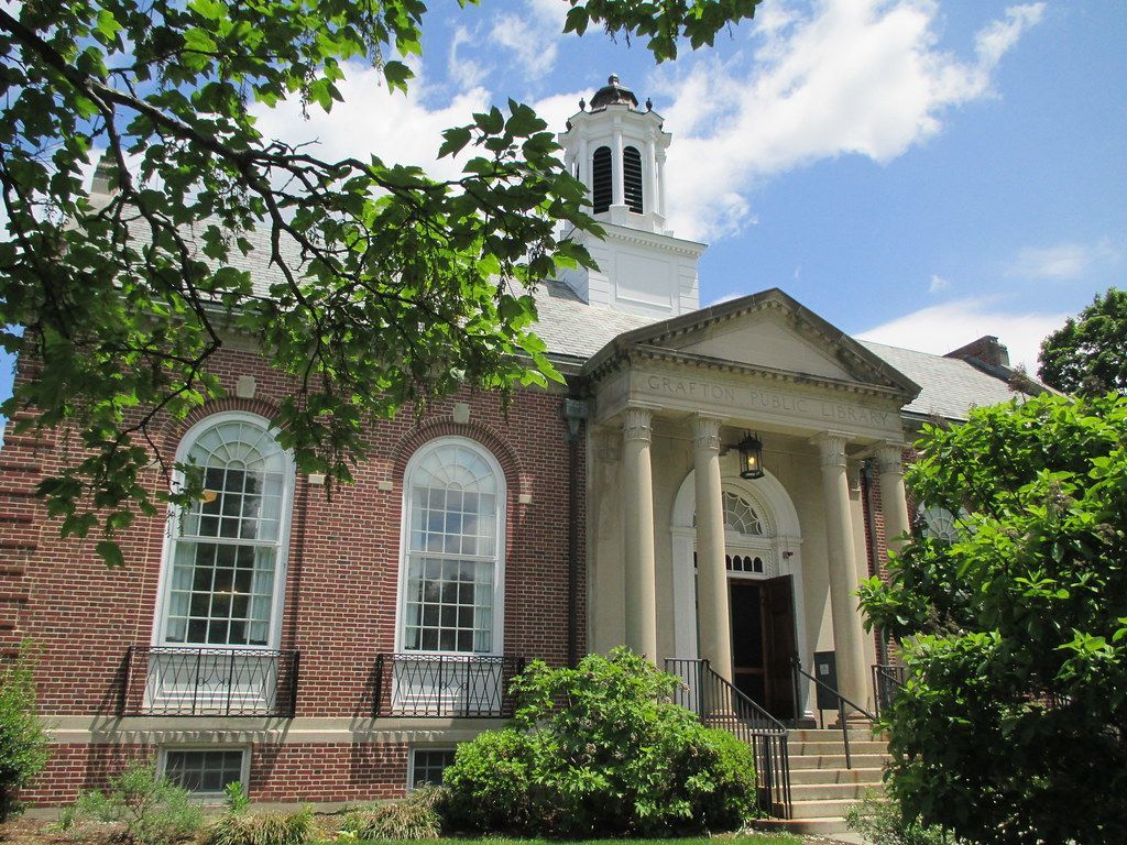 grafton wi public library brick building with a bell tower in the background